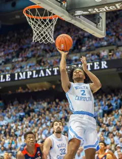Coby White goes up for a lay-up.jpg